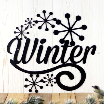 Winter metal wall decor with snowflakes, in matte black powder coat. 