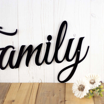 Close up of script lettering on our Family metal wall decor, in matte black powder coat. 