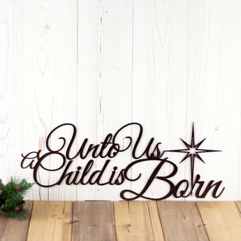 Unto Us A Child Is Born metal wall art with Christmas star, in copper vein powder coat.