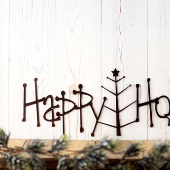 Close up of Happy Holidays text  on our Christmas metal wall art, in copper vein powder coat. 