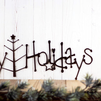 Close up of Happy Holidays text  on our Christmas metal wall art, in copper vein powder coat. 