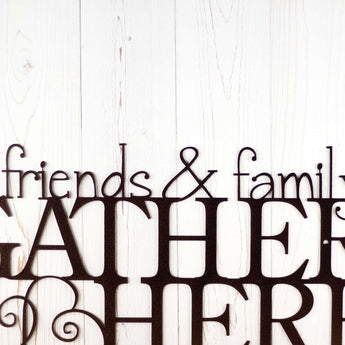 Close up of wording on our Friends & Family Gather Here metal sign, in copper vein powder coat. 