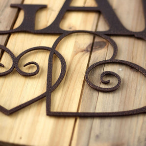 Close up of copper vein powder coat on our Friends & Family Gather Here metal sign. 