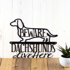 Dachshunds Live Here metal sign, with Beware, in matte black powder coat.