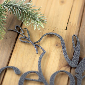 Close up of silver vein powder coat on our Peace on Earth metal sign.