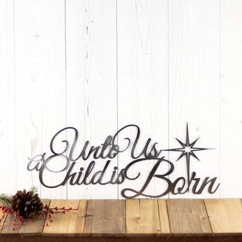 Unto Us A Child Is Born metal wall art with Christmas star, in raw steel. 