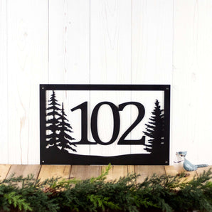 Rectangular 3 digit metal house number sign with pine trees, in matte black powder coat.