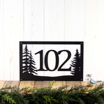 Rectangular 3 digit metal house number sign with pine trees, in matte black powder coat. 