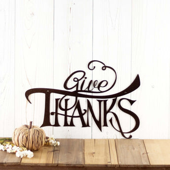 Give Thanks metal wall art with script lettering, in copper vein powder coat. 