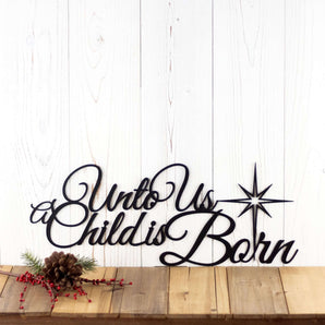 Unto Us A Child Is Born metal wall art with Christmas star, in matte black powder coat.