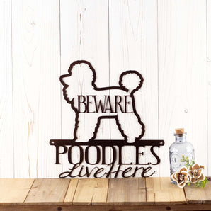 Poodles Live Here metal sign, with Beware, in copper vein powder coat.