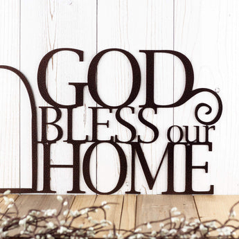 Close up of God Bless Our Home wording on our metal wall art, in copper vein powder coat.