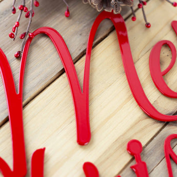Close up of red gloss powder coat on our Merry Christmas script sign. 