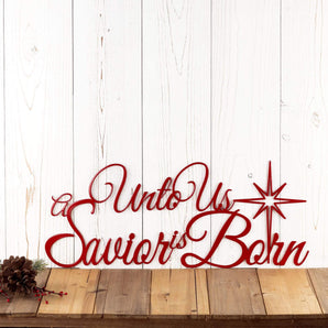 Unto us a Savior Is Born script metal wall art, with a Christmas star, in red gloss powder coat.