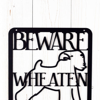 Close up of Beware Wheaten Greetin Ahead metal plaque, in matte black powder coat.