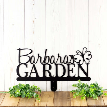 Garden metal name sign with script first name, with a butterfly, in matte black powder coat. 