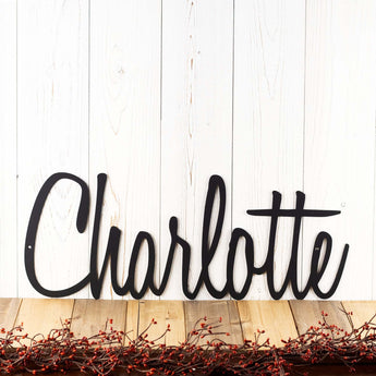 Personalized name metal sign with cursive lettering, in matte black powder coat.