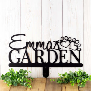Custom garden name sign with dog name and dog paws, in matte black powder coat. 