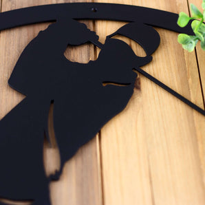 Close up of matte black powder coat on our golfer metal wall decor.