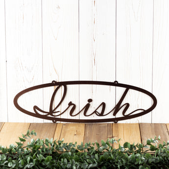 Oval family last name metal sign with script font, in copper vein powder coat.