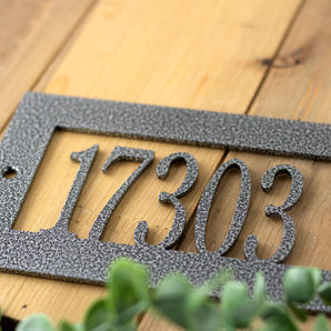 Close up of silver vein powder coat for rectangular metal address sign.