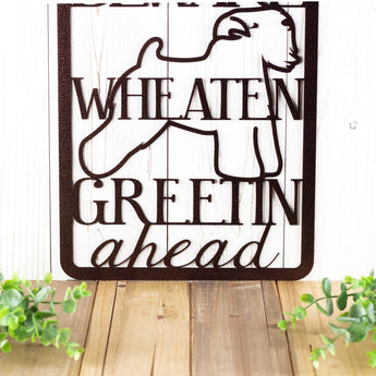 Close up of wording on our hanging metal sign with Wheaten dog silhouette, in copper vein powder coat. 
