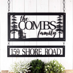 Rectangular metal family name sign and address sign with Adirondack chair and cedar trees, in matte black powder coat. 