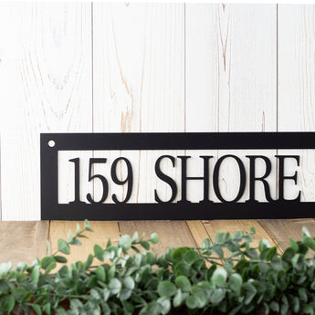 Close up of rectangular house number sign, in matte black powder coat.