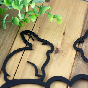 Close up of matte black powder coat on our Live Laugh Love metal wall art with bunnies. 