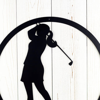 Close up of woman silhouette on our circular golf metal wall art, in matte black powder coat.