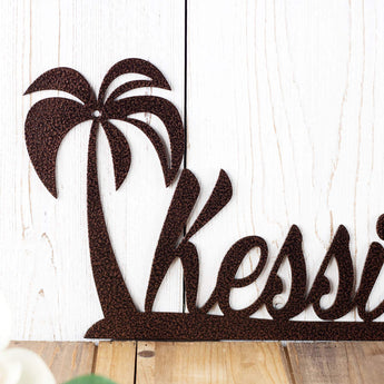 Close up of palm tree on our metal name sign, in copper vein powder coat.