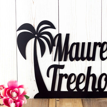 Close up of palm tree on our custom name metal wall decor, in matte black powder coat. 