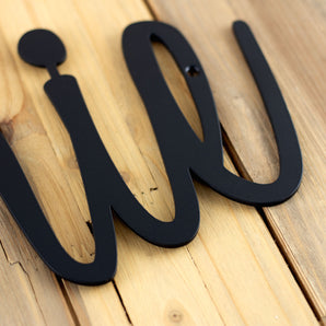 Close up of matte black powder coat on our personalized metal sign.
