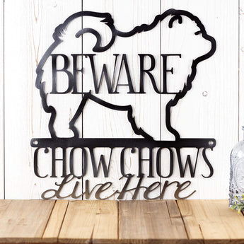 Close up of A Chow Chow Lives Here wording on our metal wall decor, in raw steel. 