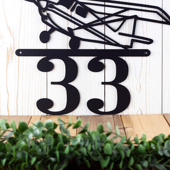 Close up of 2 digit house number on our airplane metal house number sign, in matte black powder coat. 