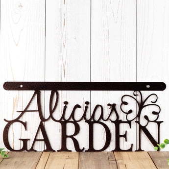 Close up of Personalized garden sign with first name and butterfly, in copper vein powder coat. 