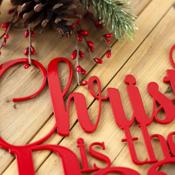 Close up of red gloss powder coat on our Christ Jesus is the reason for the season Christmas metal sign.