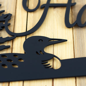 Close up of matte black powder coat on our custom metal name plaque.