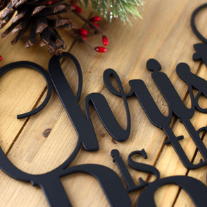 Close up of matte black powder coat on our Christ Jesus is the reason for the season Christmas metal sign.