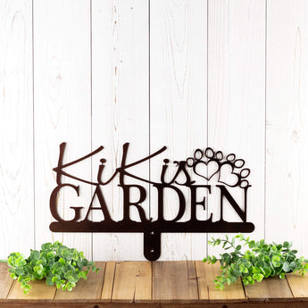 Personalized garden name sign with pet name and dog paws, in copper vein powder coat. 