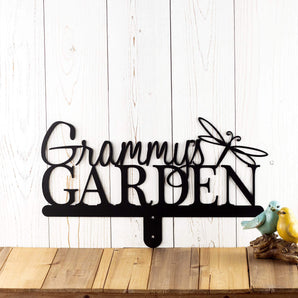 Garden name metal yard sign, with a dragonfly silhouette, in matte black powder coat. 