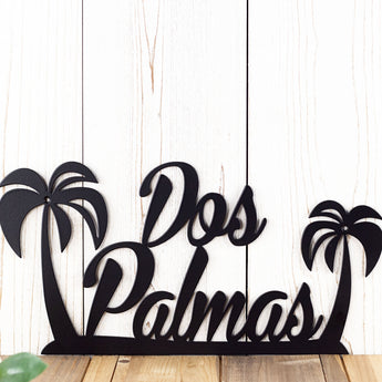 Close up of palm tree an script lettering on our custom metal sign, in matte black powder coat.