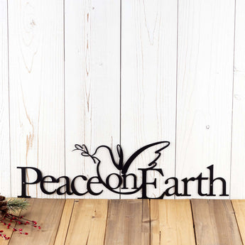 Peace on Earth metal wall art with Christmas dove, in matte black powder coat.