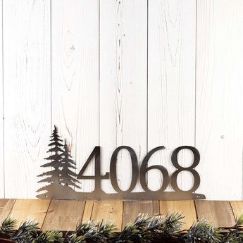4 digit metal house number plaque with pine trees, in raw steel. 