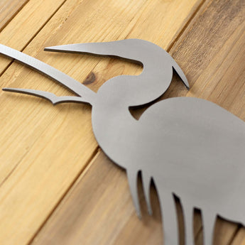 Close up of raw steel on our Heron & Cattails metal house number sign.
