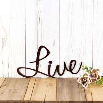 Close up of script Live word on our Live Laugh Love metal wall art, in copper vein powder coat.