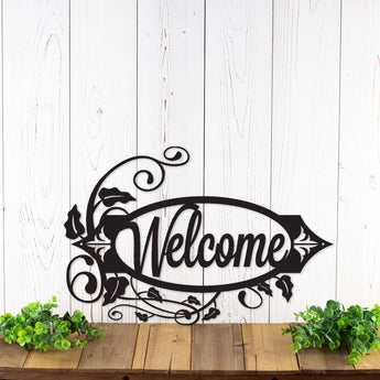 Oval script welcome metal sign with vines, in matte black powder coat. 