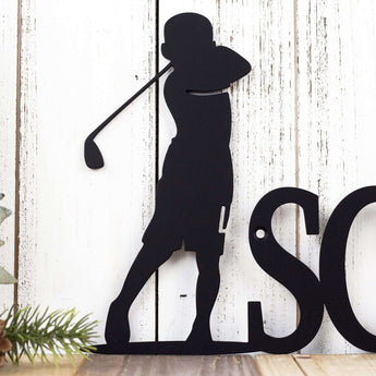 Close up of boy golfer on our custom name sign, in matte black powder coat. 
