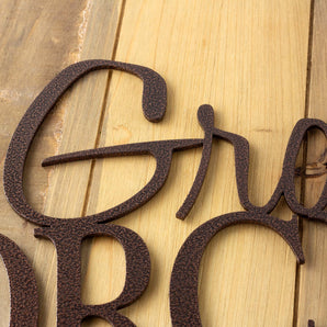 Close up of copper vein powdre coat on our custom orchard metal yard sign.
