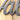 Close up of Välkommen script metal sign, in silver vein powder coat.